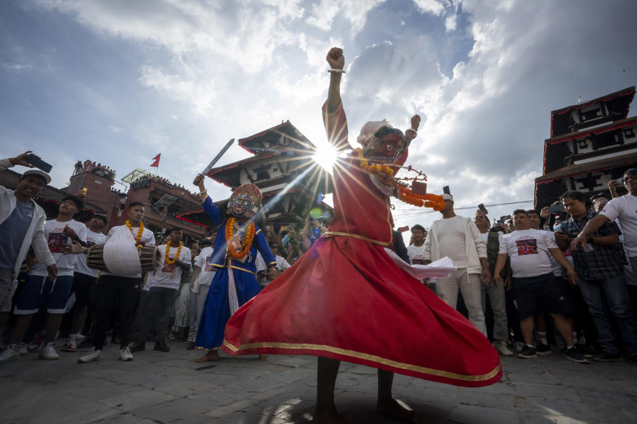 Masked dancers perform during Indra Jatra, a festival that marks the end of the rainy season in Kathmandu, Nepal, Tuesday, Sept. 17, 2024. (AP Photo/Niranjan Shrestha)