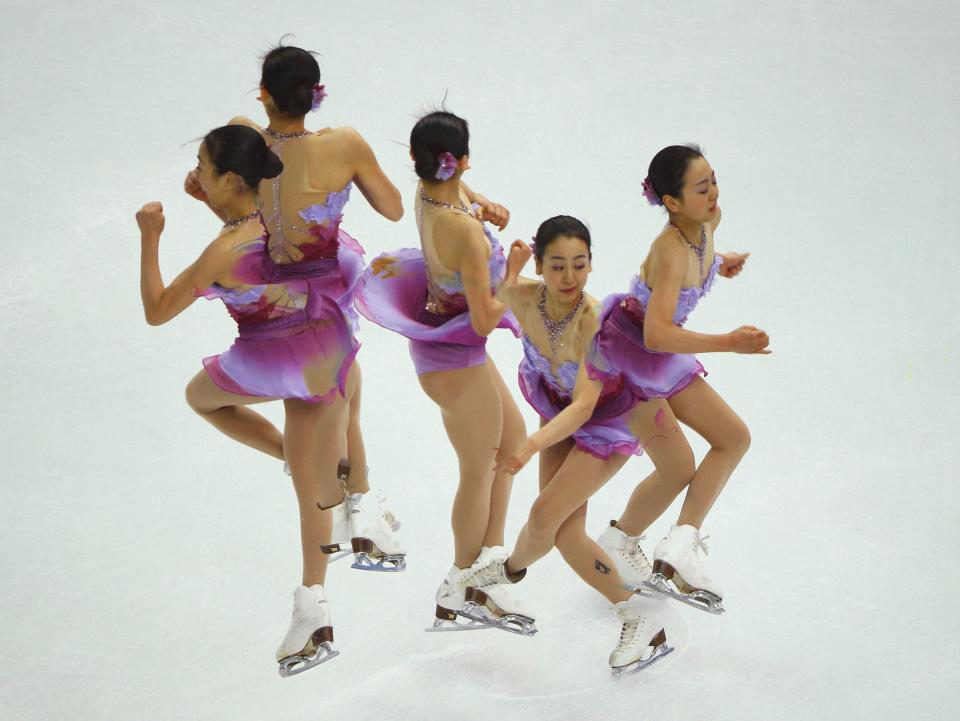 Mao Asada of Japan competes during the figure skating team ladies short program at the Sochi 2014 Winter Olympics, February 8, 2014. Picture taken with multiple exposure. REUTERS/Brian Snyder (RUSSIA - Tags: SPORT FIGURE SKATING OLYMPICS)