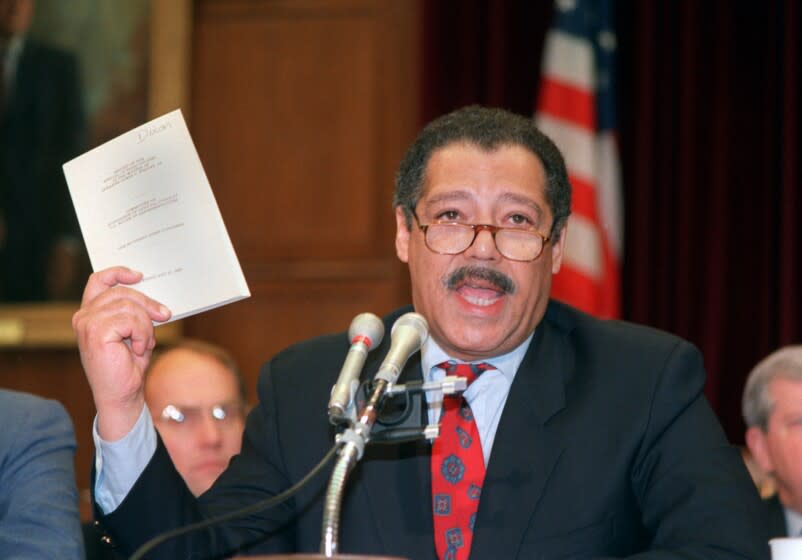 FILE––House Ethics Committee Chairman, Rep. Julian Dixon, D–Calif., holds a report about ethics violations by House Speaker Jim Wright of Texas in this April 17, 1989, file photo taken in Washington. Dixon died Friday, Dec. 8, 2000, in Los Angeles of an apparent heart attack. He was 66. (AP Photo/ Rick Bowmer, File)