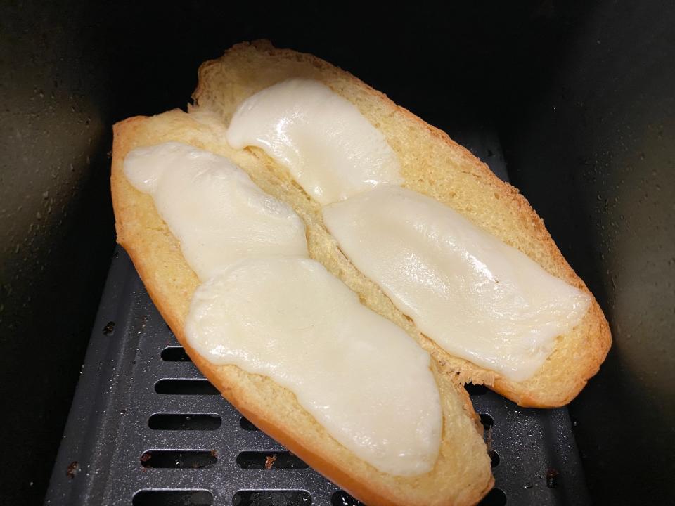 bread with cheese on it in an air fryer