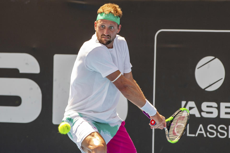 Tennys Sandgren of the U.S. plays a shot against Britain's Cameron Norrie during their singles final match in the ASB Classic at ASB Tennis Arena in Auckland, New Zealand, Saturday, Jan. 12, 2019. (AP Photo/David Rowland)