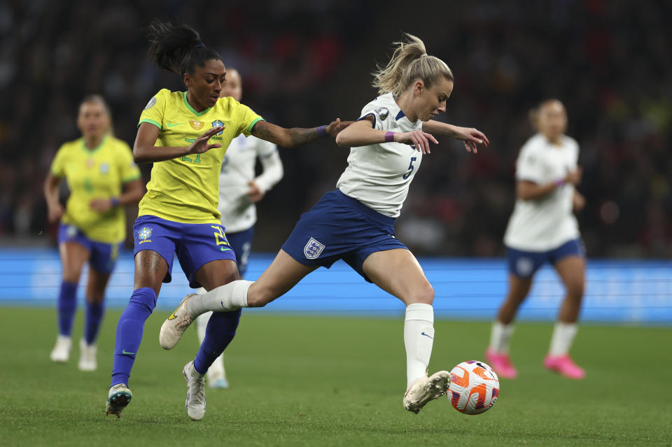 FILE - England's Leah Williamson is challenged by Brazil's Kerolin during the Women's Finalissima soccer match between England and Brazil at Wembley stadium in London, Thursday, April 6, 2023. (AP Photo/Ian Walton, File)