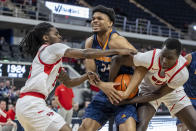 Western Kentucky guard Don McHenry (2) and Western Kentucky forward Babacar Faye (5) battle UTEP forward Kevin Kalu (34) for a loose ball during the first half of an NCAA college basketball game at the Conference USA Tournament final, Saturday, March 16, 2024, in Huntsville, Ala. (AP Photo/Vasha Hunt)