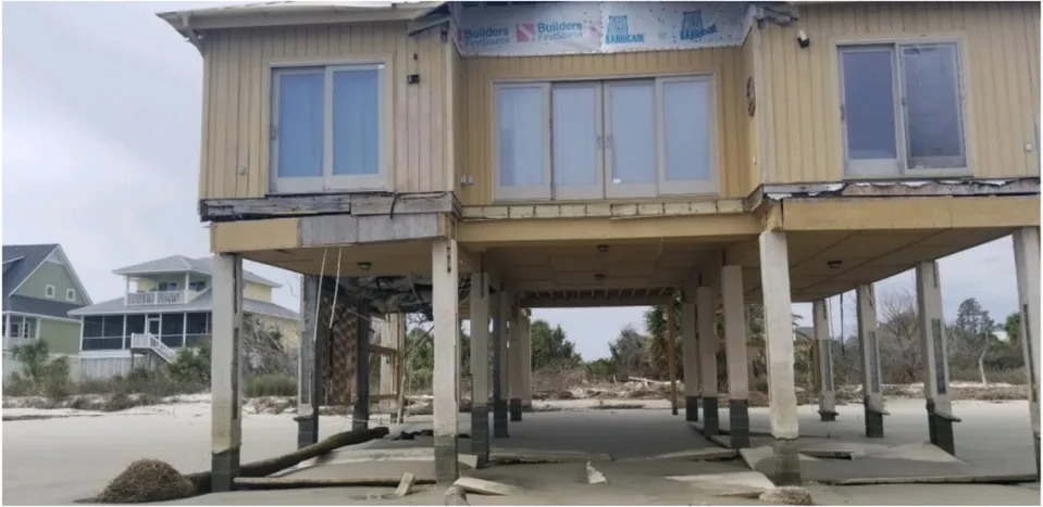 A photo of an abandoned beachfront home on Harbor Island in Beaufort County, South Carolina, in 2020. The home was battered to an uninhabitable state after Hurricane Matthew hit in 2016.