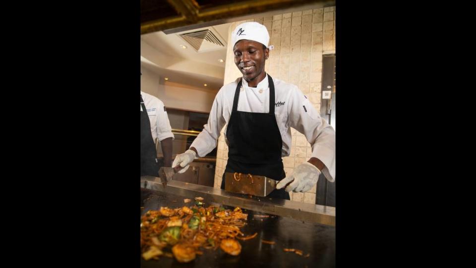 Chef James Franklin prepares food to the customer’s order at the new live cooking stations at the remodeled buffet at the Beau Rivage Resort and Casino in Biloxi