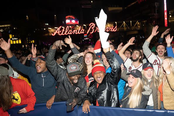 ATLANTA, GA - NOVEMBER 02: Atlanta Braves fans celebrate as they follow Game Six of the World Series against the Houston Astros on November 2, 2021 in Atlanta, Georgia. The Braves defeated the Astros 7-0 to win the World Series for the first time since 1995. (Photo by Megan Varner/Getty Images)