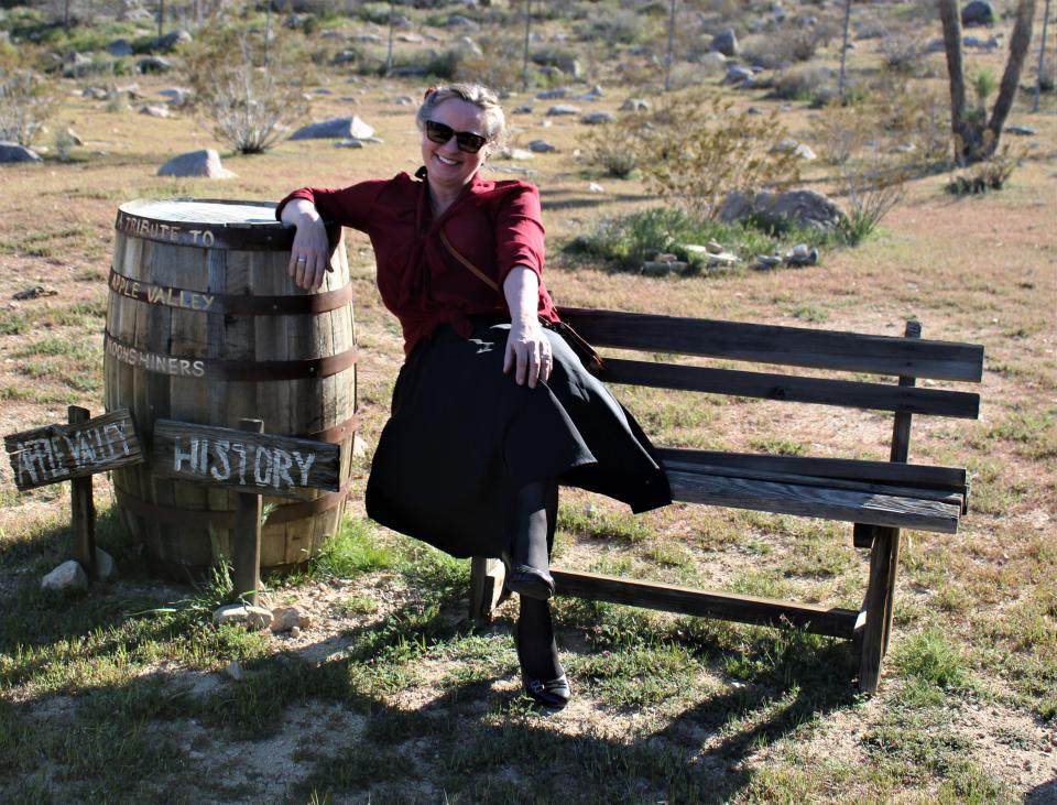 Laureen near the Whiskey Barrel at Apple Valley Legacy Museum.