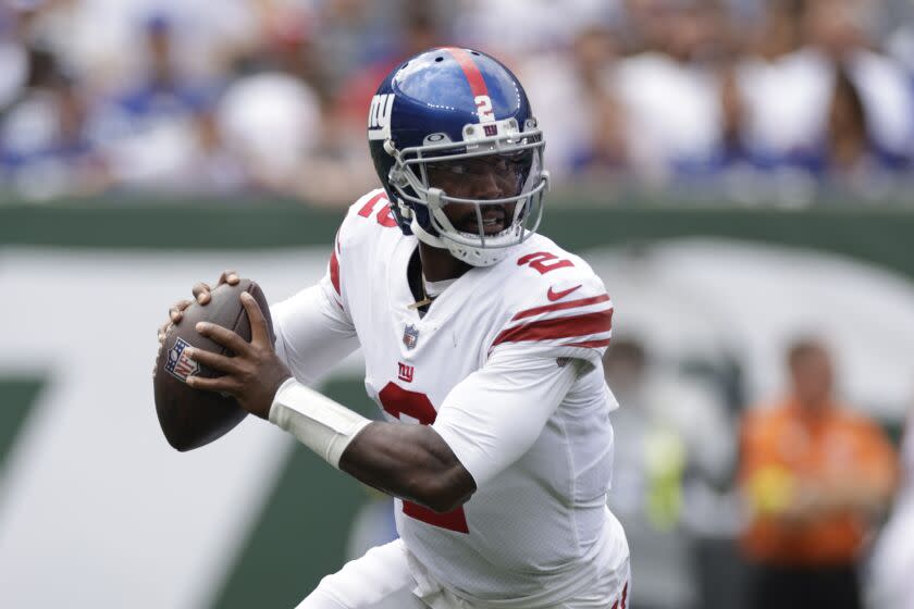 New York Giants quarterback Tyrod Taylor (2) looks to pass in the first half of a preseason.