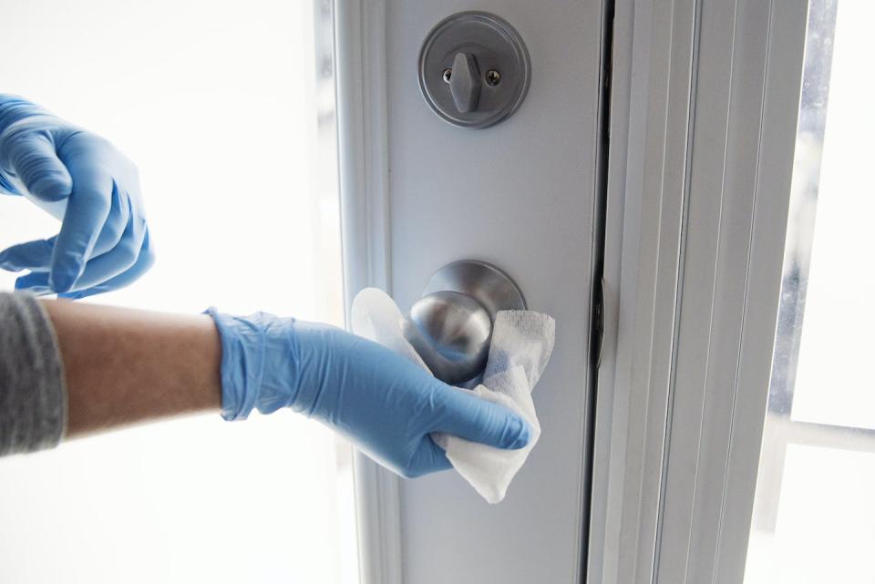 Unnecessary disinfectant use can contribute to antimicrobial resistance and increase exposure to toxic chemicals. <a href="https://www.gettyimages.com/detail/photo/hands-with-glove-wiping-doorknob-royalty-free-image/1212740392" rel="nofollow noopener" target="_blank" data-ylk="slk:martinedoucet/E+ via Getty Images;elm:context_link;itc:0;sec:content-canvas" class="link ">martinedoucet/E+ via Getty Images</a>