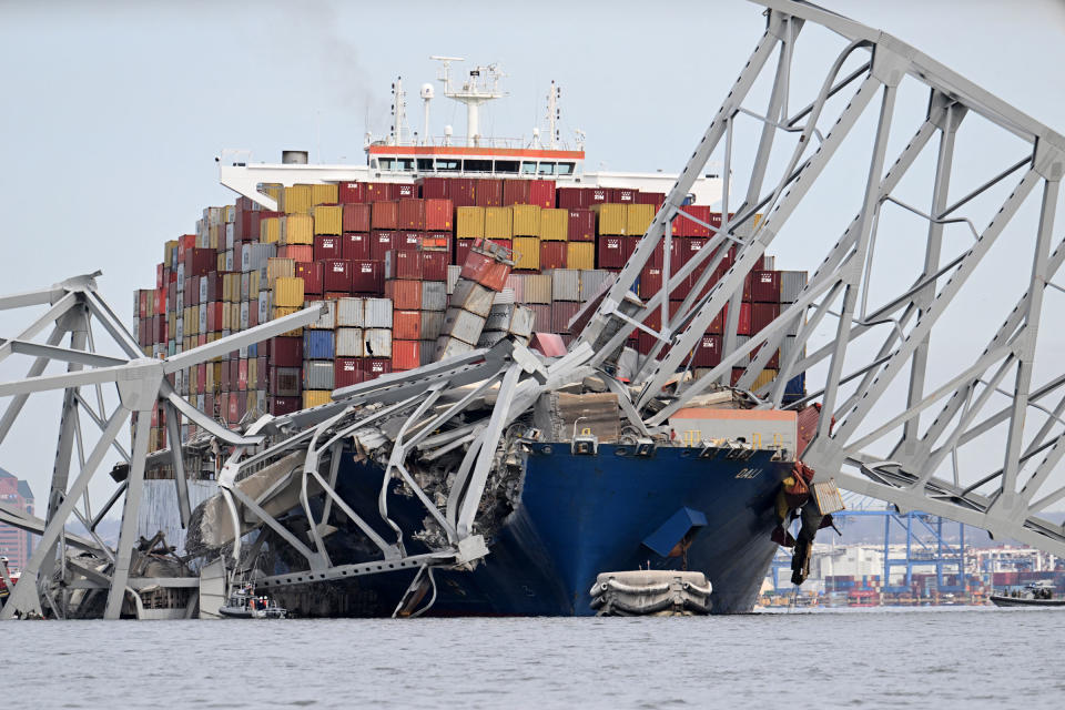 The steel frame of the Francis Scott Key Bridge sits on top of the container ship Dali after the bridge collapsed, in Baltimore, on March 26, 2024.<span class="copyright">Jim Watson—AFP/Getty Images</span>