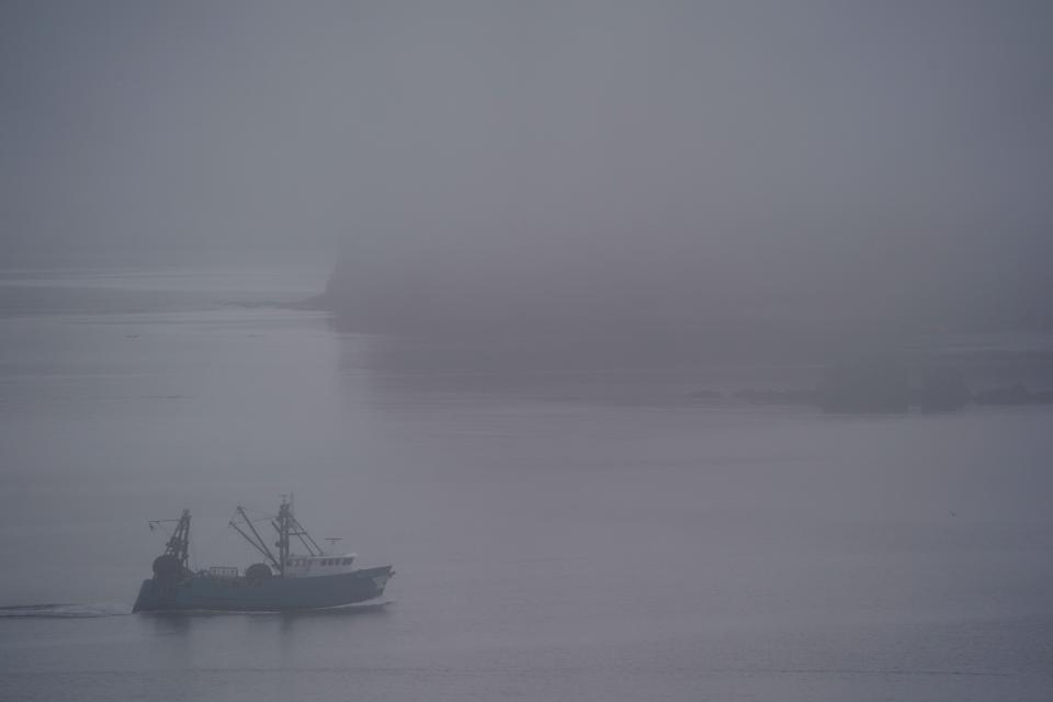 A boat, that can be used for trawling, heads out to sea, Friday, June 23, 2023, near Kodiak, Alaska. Crab fishermen in Alaska have been scrambling to stay afloat after two years of the Bering Sea fishery being closed or severely curtailed due to plummeting crab numbers. (AP Photo/Joshua A. Bickel)