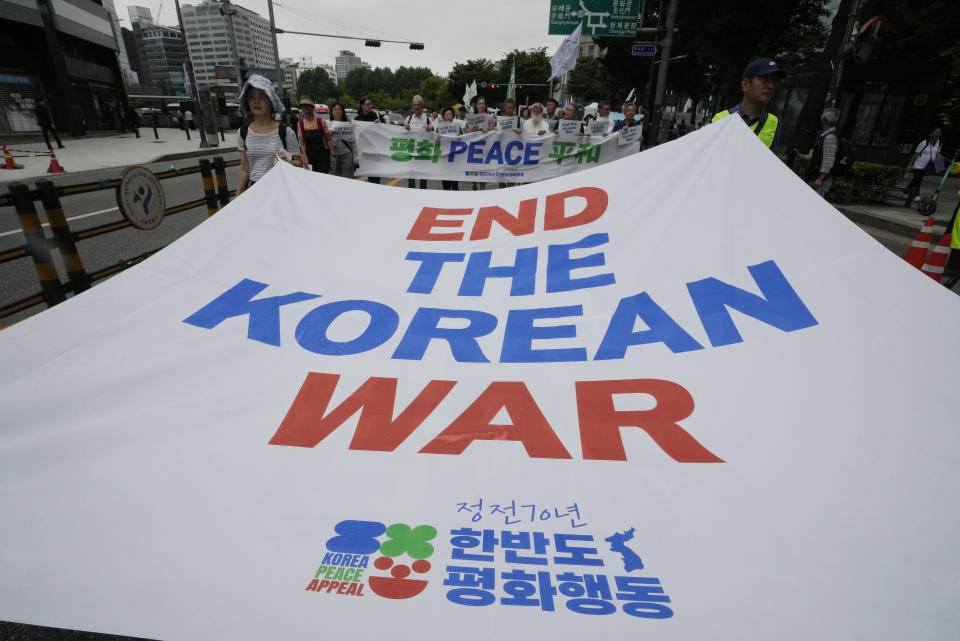Participants march during a rally commemorating the 70th anniversary of the Korean War Armistice Agreement, in Seoul, South Korea, Saturday, July 22, 2023. The truce that stopped the bloodshed in the Korean War turns 70 years old on Thursday, July 27, 2023 and the two Koreas are marking the anniversary in starkly different ways, underscoring their deepening nuclear tensions. (AP Photo/Ahn Young-joon)