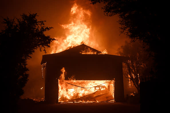 A house burns in a residential neighbourhood near Empire Grade in Bonny Doon, California.