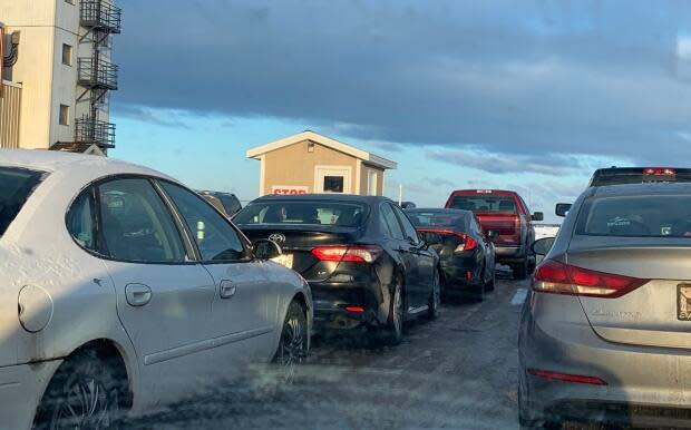 People line up in their vehicles Friday morning for testing in Slemon Park, just outside of Summerside, where three new cases of COVID-19 were announced Thursday. (Submitted by Bill Schurman - image credit)