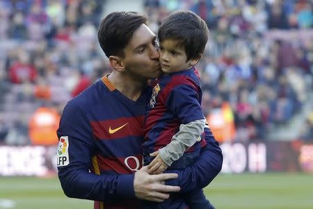 Football Soccer - Barcelona v Real Sociedad - Spanish Liga BBVA - Camp Nou, Barcelona, Spain - 28/11/15 Barcelona's Lionel Messi kisses his son Thiago before the match REUTERS/Albert Gea