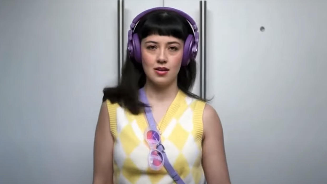  Woman wearing in purple headphones in Allegra commercial. 