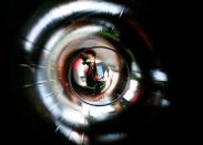 FILE PHOTO: Woman cleans inside of exhibit representing natural gas pipeline during final preparations at the Hannover Messe industrial trade fair in Hannover
