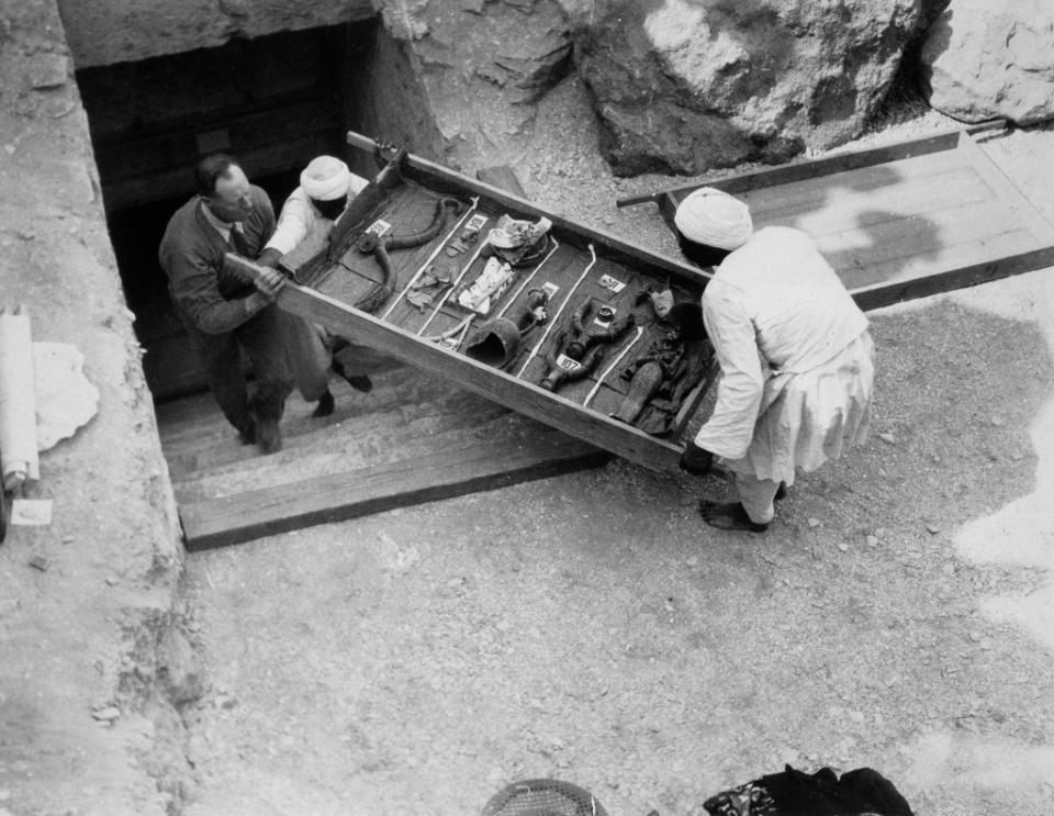 Workers remove a tray of chariot parts from the Tomb of Tutankhamun in the Valley of the Kings, Egypt, in 1922. Getty Images