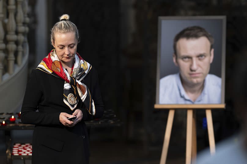 Yulia Navalnaya lights a candle for her husband at St. Mary's Church in Berlin.