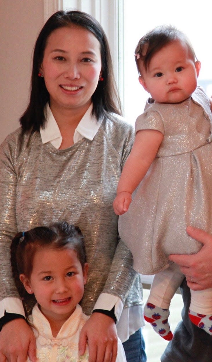 Sam and Daisy Roth pose with their daughters, 10-month-old Adalynn and 5-year-old named Abigail, for a holiday card in Dec., 2020. 