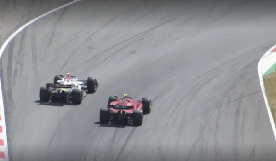 Lewis Hamilton passes Carlos Sainz.