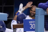 Los Angeles Dodgers' Will Smith, left, is congratulated by Albert Pujols after hitting a solo home run during the second inning of a baseball game against the Arizona Diamondbacks Monday, May 17, 2021, in Los Angeles. (AP Photo/Mark J. Terrill)