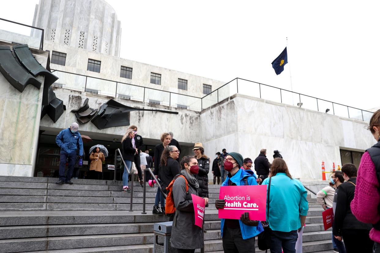 People in late March line up to try to get into a public legislative hearing for House Bill 2002.