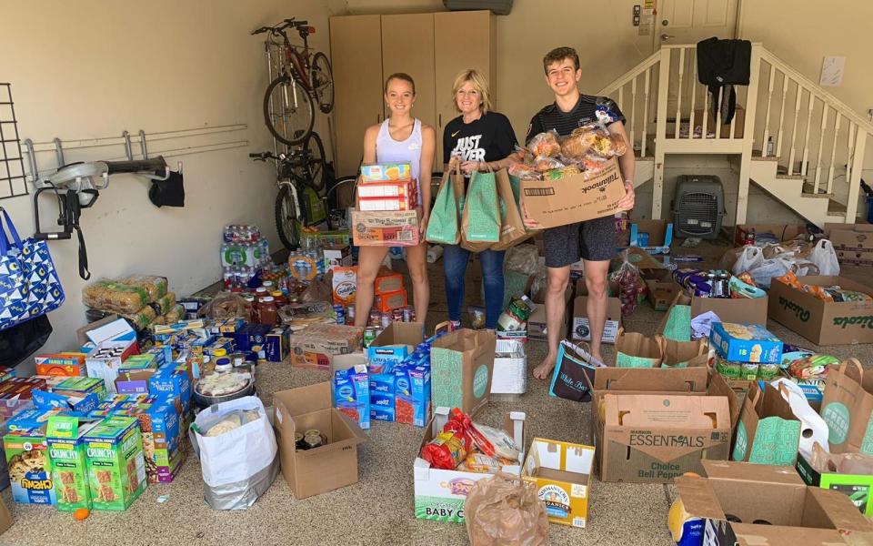 Katie Swan with her mother Nicki and her brother, and the food they are donating