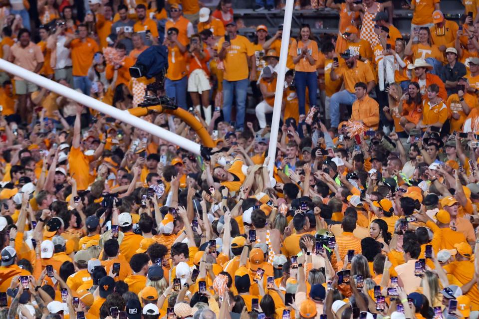 Tennessee fans tear down the goal posts at Neyland Stadium after the Volunteers beat Alabama 52-49 last Saturday. RANDY SARTIN/USA Today Sports