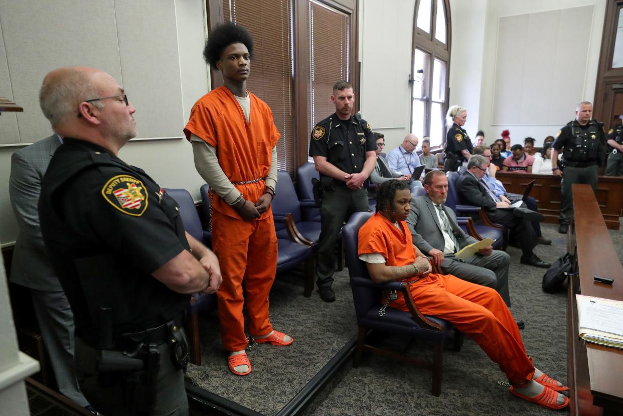 In a packed courtroom, Nino Jennings, who pleaded guilty to aggravated robbery and a gun specification, stands to be sentenced Monday for his role in the 2022 shooting death of Damarcus Hartwell at the Summit County Courthouse.