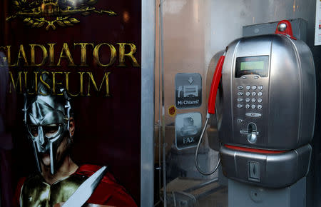 FILE PHOTO: A Telecom Italia phone booth is pictured in downtown Rome, Italy, June 5, 2018. REUTERS/Stefano Rellandini/File Photo