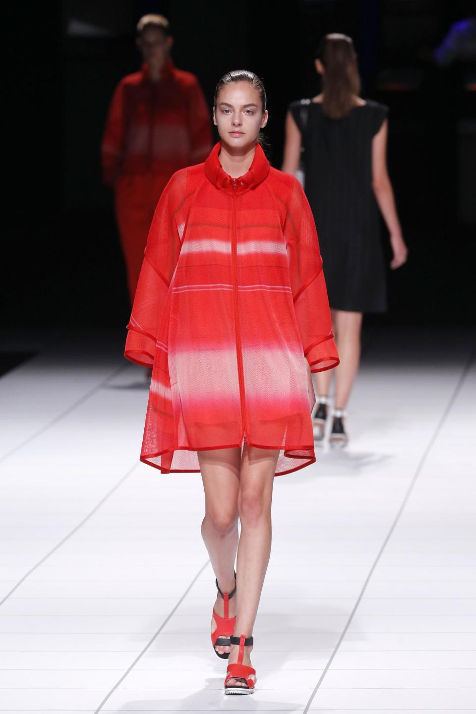 A model presents a creation as part of Issey Miyake's ready-to-wear Spring/Summer 2014 fashion collection, presented Friday, Sept. 27, 2013 in Paris. (AP Photo/Jacques Brinon)