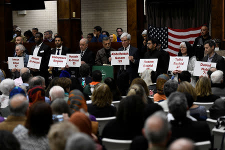 Community leaders hold signs with the names of the New Zealand mosque attack victims at Dar Al-Hijrah Islamic Center in Falls Church, Virginia, U.S., March 16, 2019. REUTERS/Sait Serkan Gurbuz