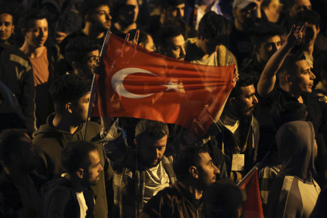 Supporters of Kemal Kilicdaroglu, the 74-year-old leader of the center-left, pro-secular Republican People's Party, or CHP, gather outside the party's headquarters in Ankara, Turkey, Sunday, May 14, 2023. More than 64 million people, including 3.4 million overseas voters, were eligible to vote. (AP Photo)