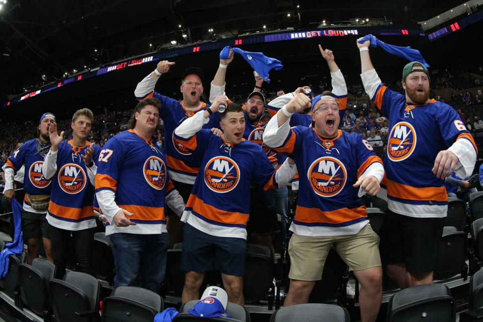 Members of the New York Jets cheer during the first round. They returned for the Bruins series, too.