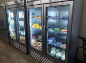 In this photo provided by Paul Juarez, refrigerators are stocked with produce, milk and juice at Linda Tutt High School's student-led grocery store on Nov. 20, 2020, in Sanger, Texas. (Paul Juarez via AP)