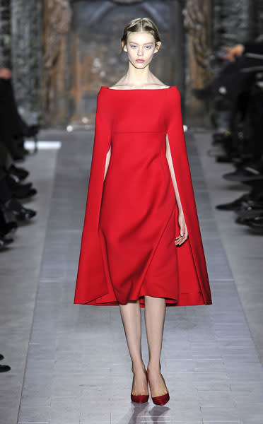 <b>Valentino SS13 </b><br><br>Valentino dressed his models in head-to-toe vivid red, while keeping their hair and make-up bare.<br><br>© Rex