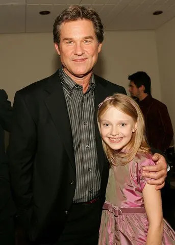 <p>Evan Agostini/Getty</p> Kurt Russell and Dakota Fanning at the premiere of 'Dreamer' in 2005