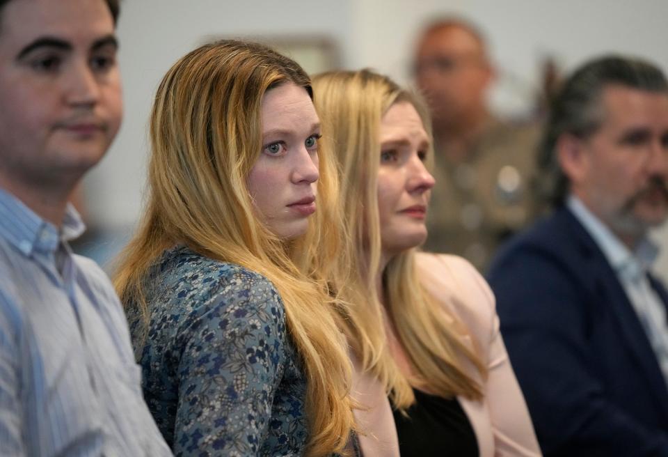 Taylor Edwards, left, and Kaitlyn Kash, who are plaintiffs in Zurawski v Texas, listen at the Texas Medical Board meeting to discuss guidance around physicians for medical exceptions to the state’s abortion ban laws at the George H.W. Bush State Office Building Friday March 22, 2024.