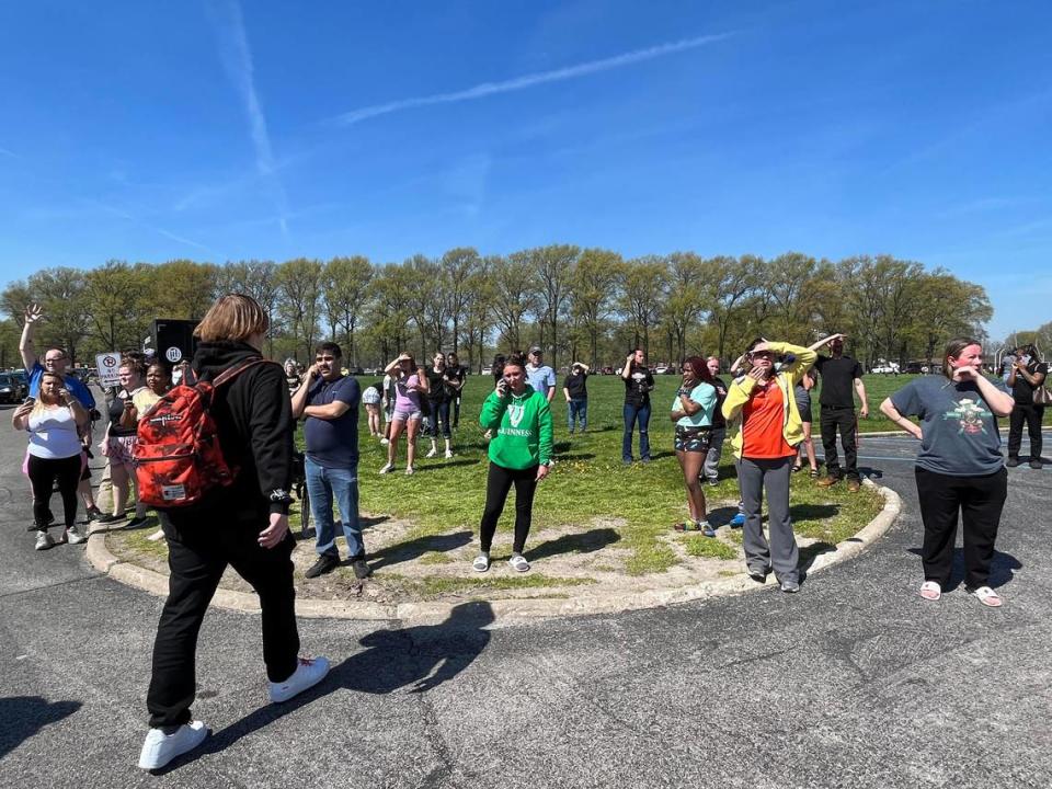 Parents of Granite City High School students wait anxiously outside the exit, some waving and shouting for their children. Police would not allow them to get any closer to the building after a threat of violence forced a lockdown, then early dismissal as agents from multiple police units and FBI investigated.