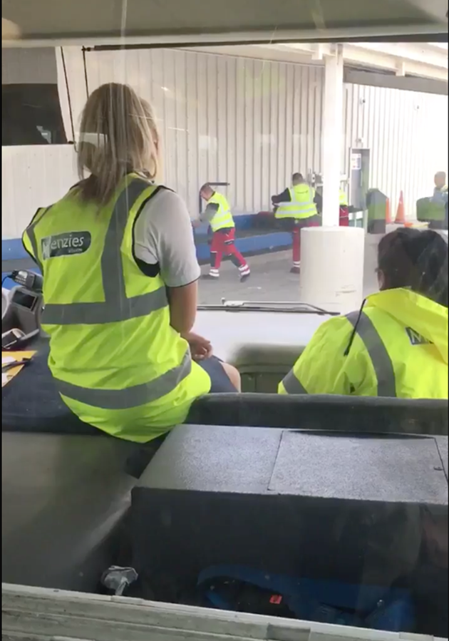 A Twitter user filmed baggage handlers appearing to toss luggage onto the conveyor belt. Photo: Twitter/@TheMarasco