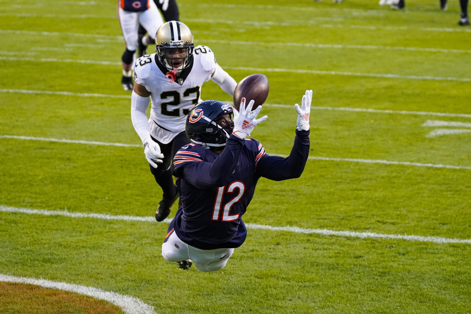 Chicago Bears wide receiver Allen Robinson (12) makes a catch for a touchdown in front of New Orleans Saints cornerback Marshon Lattimore (23) in the first half of an NFL football game in Chicago, Sunday, Nov. 1, 2020. (AP Photo/Nam Y. Huh)