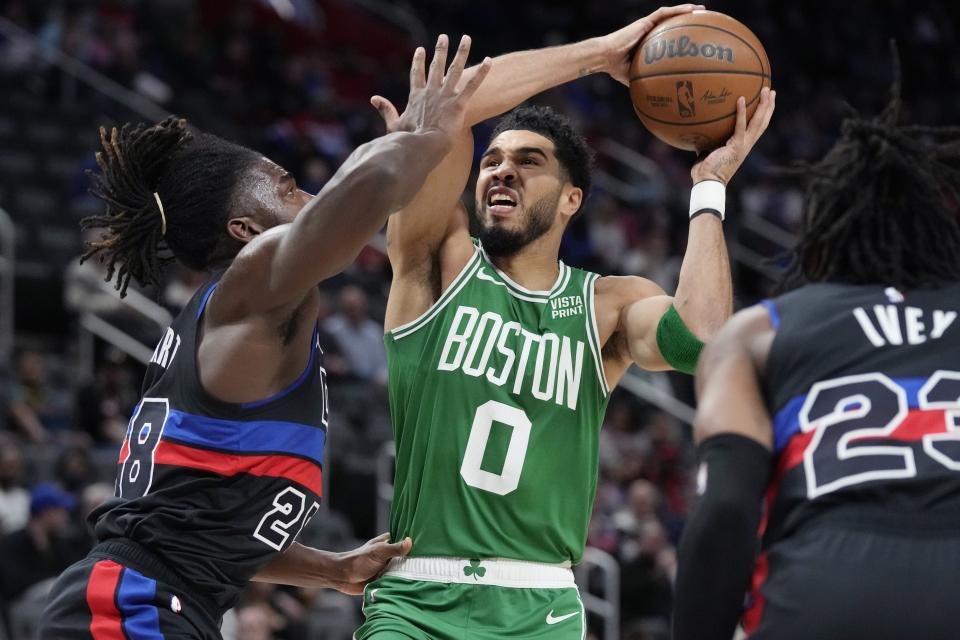 Celtics forward Jayson Tatum is defended by Pistons center Isaiah Stewart during the first half on Saturday, Nov. 12, 2022, at Little Caesars Arena.