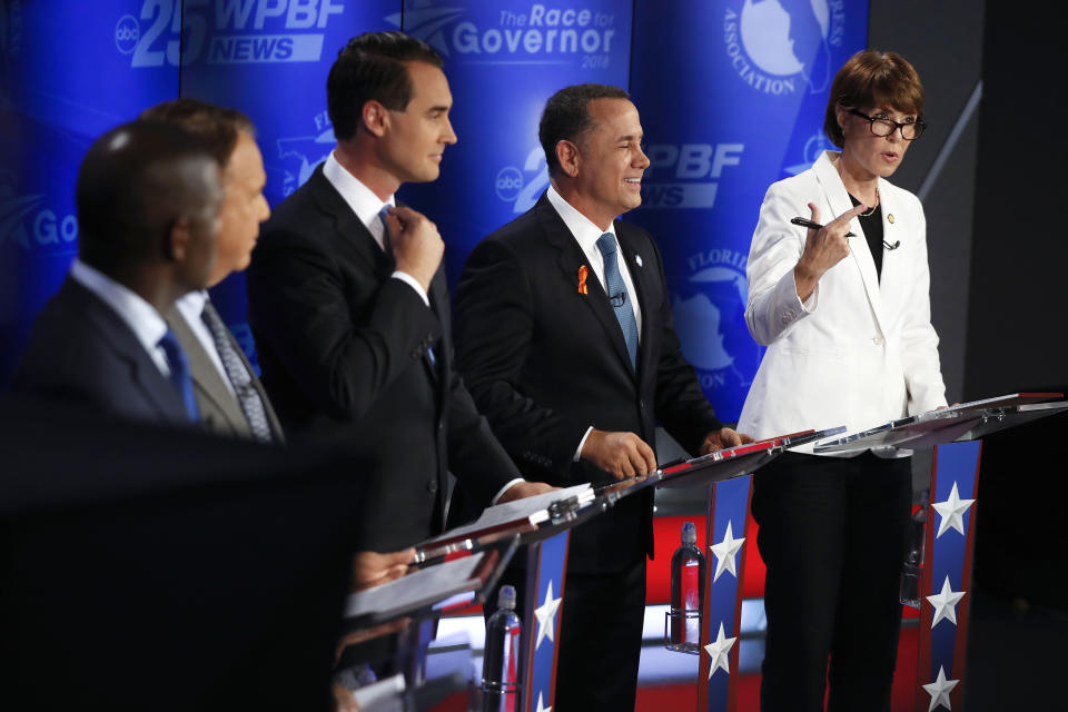 Democratic gubernatorial candidates, from right, Gwen Graham, Philip Levine, Chris King, Jeff Greene and Andrew Gillum await the start of a debate ahead of the Democratic primary for governor on Thursday, Aug. 2, 2018, in Palm Beach Gardens, Fla. (AP Photo/Brynn Anderson)