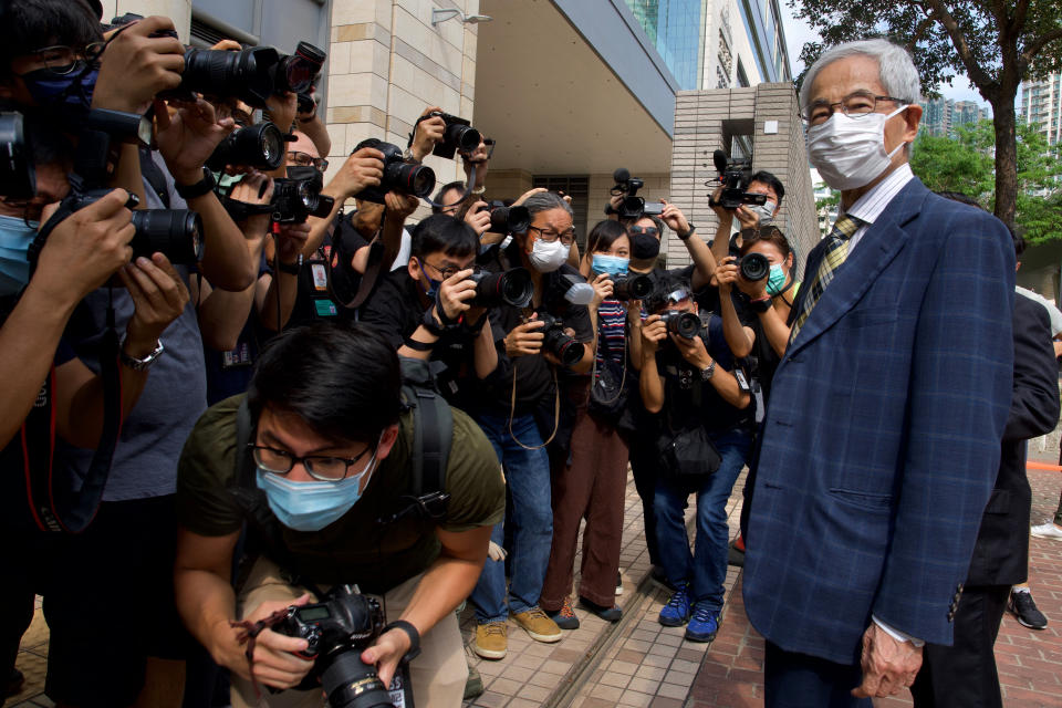 Pro-democracy lawmaker Martin Lee, right, arrives at a court in Hong Kong Thursday, April 1, 2021. Seven pro-democracy advocates, including media tycoon Jimmy Lai and veteran of the city's democracy movement Lee, are expected to be handed a verdict for organizing and participating in an illegal assembly during massive anti-government protests in 2019 as Hong Kong continues its crackdown on dissent. (AP Photo/Vincent Yu)