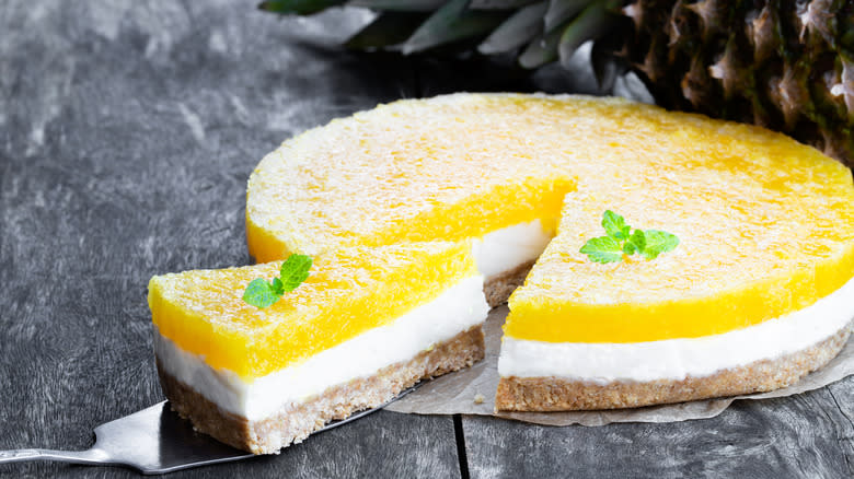 Layered pineapple cheesecake on table