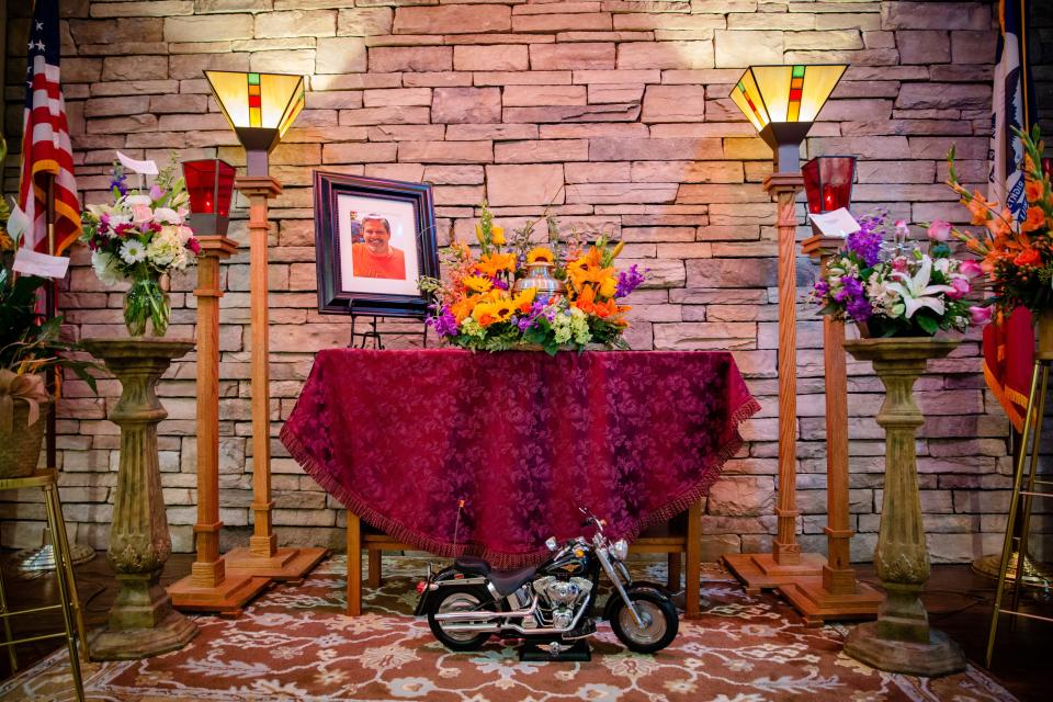 Mementos and flowers surround Rodney Eurom's urn during his funeral in Marshalltown.