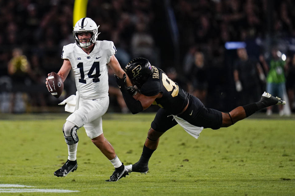 Penn State quarterback Sean Clifford (14) capped his team's game-winning drive with a 10-yard TD pass in the closing minute against Purdue. (AP Photo/Michael Conroy)