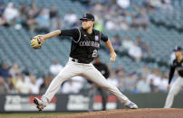 Colorado Rockies starting pitcher Kyle Freeland works against the Seattle Mariners during the first inning of a baseball game, Tuesday, June 22, 2021, in Seattle. (AP Photo/John Froschauer)