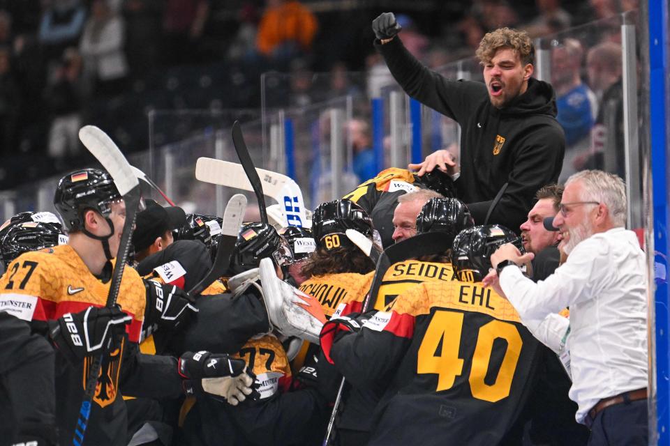 Germany celebrates their victory after the IIHF Ice Hockey Men's World Championship semi-final match between United States and Germany in Tampere, Finland on May 27, 2023.